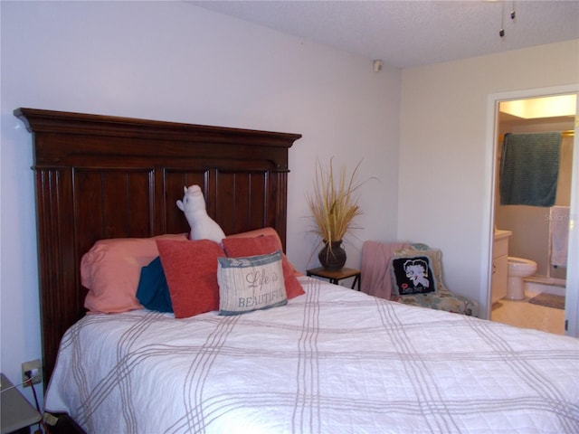 bedroom featuring ensuite bath