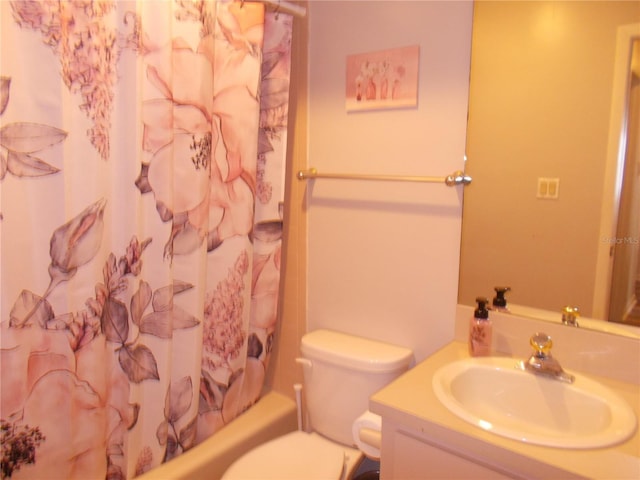 bathroom featuring toilet, vanity, and shower / tub combo with curtain