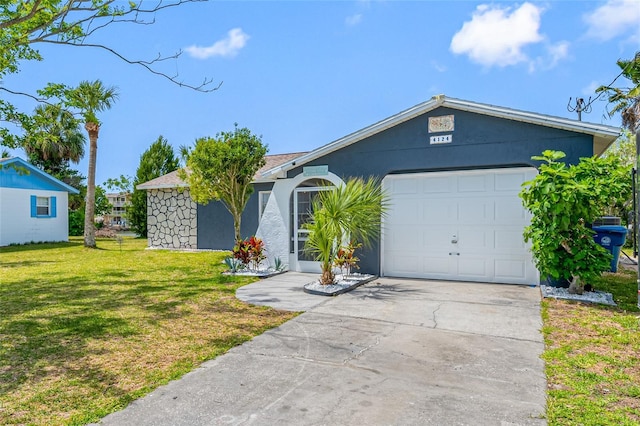 ranch-style house with stucco siding, a front lawn, driveway, and an attached garage