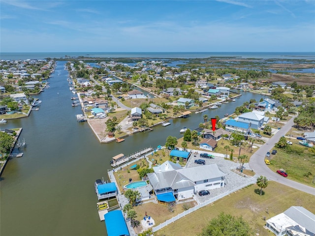 bird's eye view with a water view and a residential view