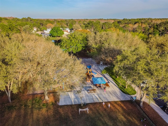 birds eye view of property with a view of trees