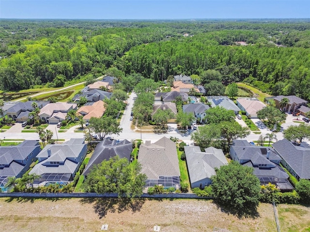 bird's eye view with a residential view and a wooded view