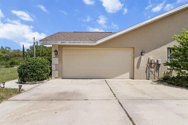 garage featuring driveway