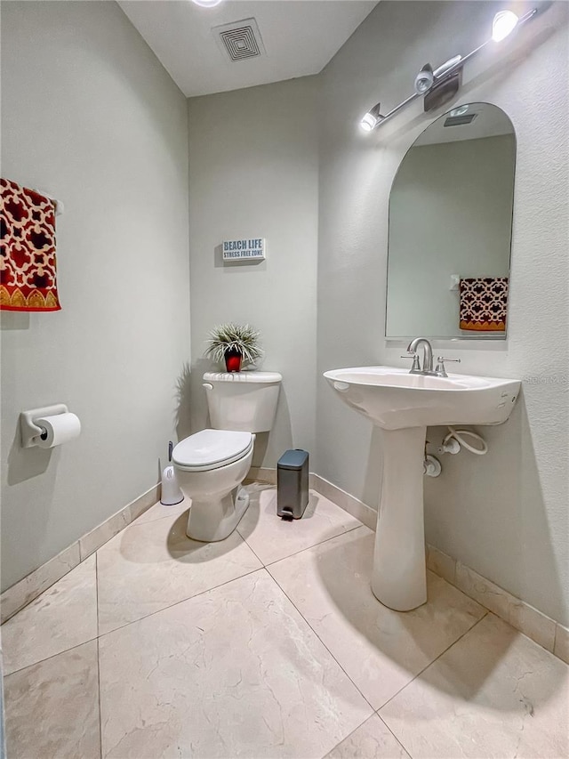11102 Avery Oaks Dr, Tampa, FL 33625 - bathroom with baseboards, visible vents, tile patterned flooring, and toilet