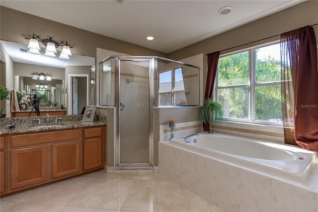 11102 Avery Oaks Dr, Tampa, FL 33625 - bathroom featuring recessed lighting, a shower stall, tile patterned flooring, vanity, and a garden tub