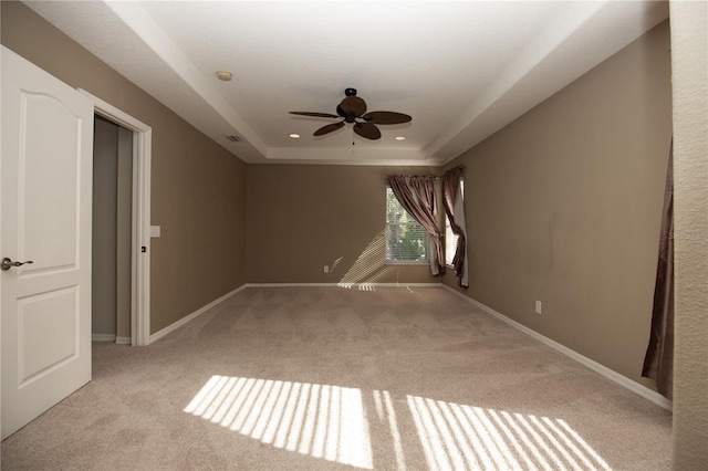 11102 Avery Oaks Dr, Tampa, FL 33625 - spare room featuring a ceiling fan, baseboards, carpet, and a raised ceiling