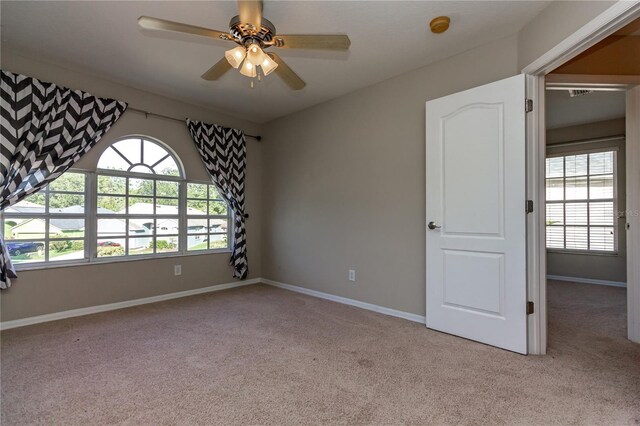 11102 Avery Oaks Dr, Tampa, FL 33625 - carpeted empty room featuring ceiling fan and baseboards