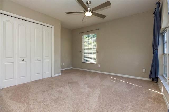 11102 Avery Oaks Dr, Tampa, FL 33625 - unfurnished bedroom featuring a ceiling fan, baseboards, carpet floors, and a closet