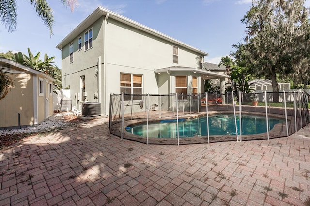 11102 Avery Oaks Dr, Tampa, FL 33625 - view of pool with fence, a fenced in pool, central air condition unit, and a patio