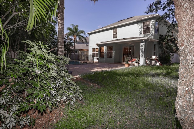 11102 Avery Oaks Dr, Tampa, FL 33625 - back of property featuring stucco siding, a pool, and a patio