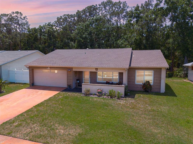 1144 Lanyard St, Palm Harbor, FL 34685 - single story home featuring fence, a shingled roof, a front lawn, a garage, and concrete driveway