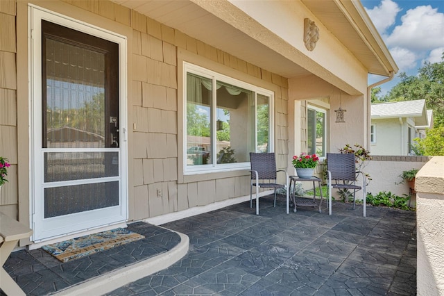 1144 Lanyard St, Palm Harbor, FL 34685 - view of exterior entry with a patio area