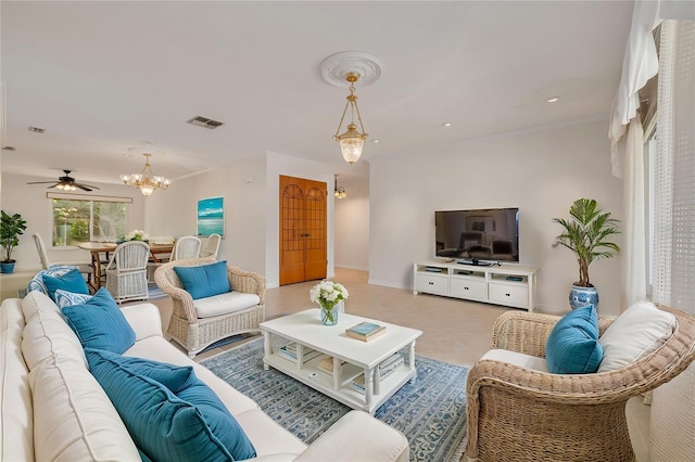 1144 Lanyard St, Palm Harbor, FL 34685 - living room featuring crown molding, baseboards, visible vents, and ceiling fan with notable chandelier