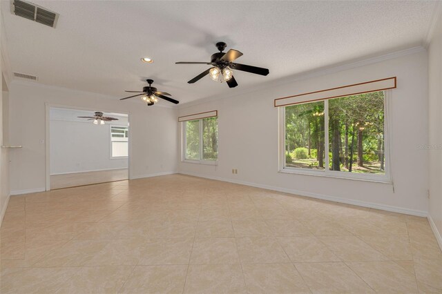 1144 Lanyard St, Palm Harbor, FL 34685 - empty room featuring crown molding, light tile patterned floors, ceiling fan, and visible vents