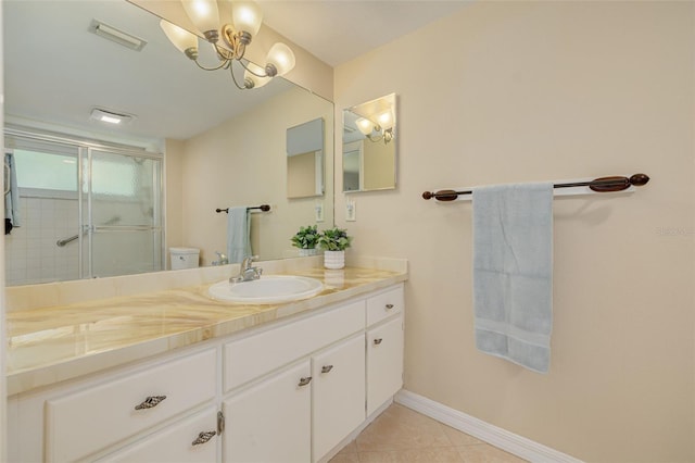 1144 Lanyard St, Palm Harbor, FL 34685 - bathroom featuring vanity, an inviting chandelier, toilet, baseboards, and a stall shower