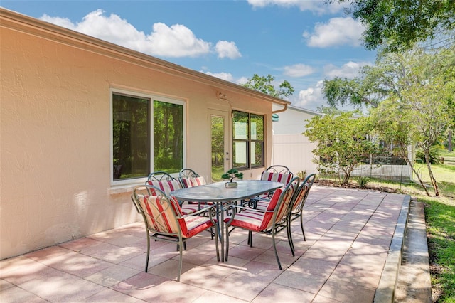 1144 Lanyard St, Palm Harbor, FL 34685 - view of patio / terrace featuring fence and outdoor dining area