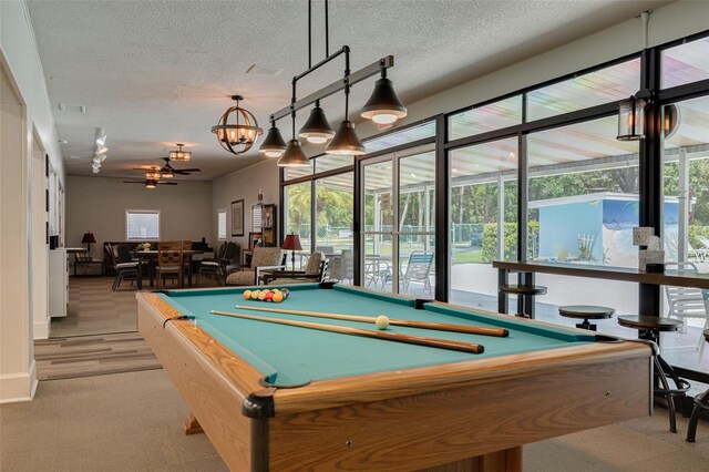 1144 Lanyard St, Palm Harbor, FL 34685 - playroom with pool table, light colored carpet, a textured ceiling, and visible vents