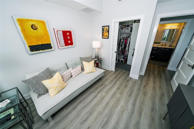 living area with wood finished floors and baseboards