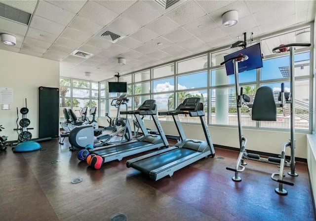 workout area featuring a paneled ceiling and visible vents