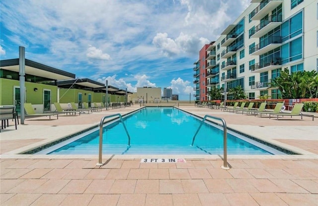 community pool featuring a patio area