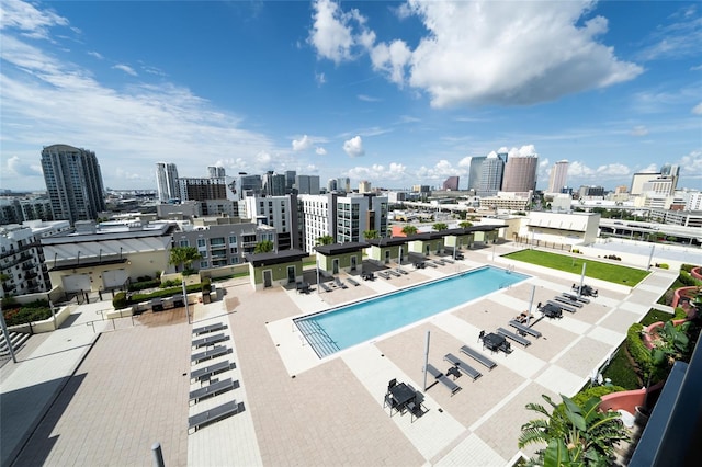 pool featuring a view of city and a patio