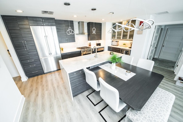 1120 E Kennedy Blvd Unit 1208, Tampa, FL 33602 - dining space with a chandelier, light wood-style flooring, and recessed lighting