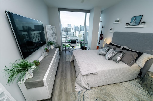 1120 E Kennedy Blvd Unit 1208, Tampa, FL 33602 - bedroom with floor to ceiling windows and wood finished floors