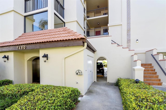 7480 Bayshore Dr Unit 402, Treasure Island, FL 33706 - entrance to property featuring stucco siding and a tiled roof