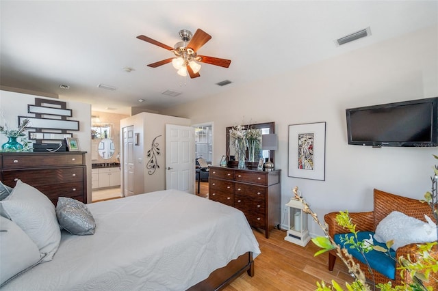 708 Sandy Hills Ave, Tarpon Springs, FL 34689 - bedroom with wood finished floors, ensuite bathroom, and ceiling fan