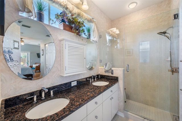708 Sandy Hills Ave, Tarpon Springs, FL 34689 - ensuite bathroom with a shower stall, double vanity, and a ceiling fan