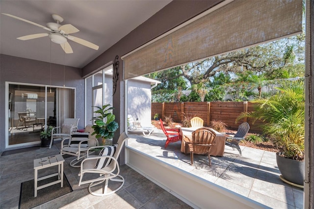 708 Sandy Hills Ave, Tarpon Springs, FL 34689 - sunroom featuring a ceiling fan and outdoor dining area