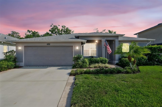 708 Sandy Hills Ave, Tarpon Springs, FL 34689 - ranch-style house with stucco siding, concrete driveway, a garage, and a front yard
