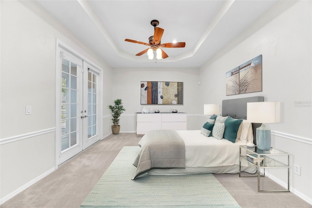 bedroom featuring french doors, baseboards, light colored carpet, and access to exterior
