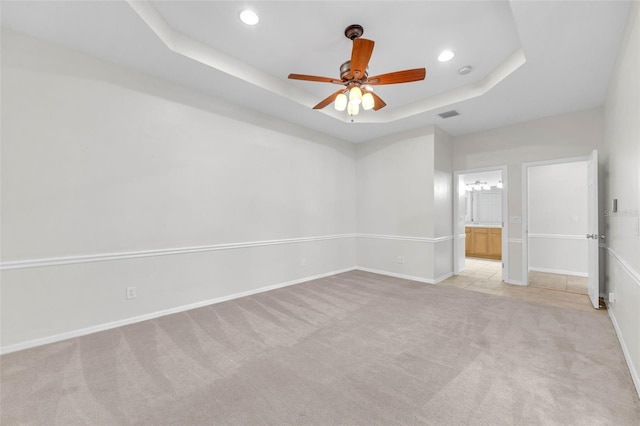 unfurnished bedroom with recessed lighting, baseboards, visible vents, and light carpet