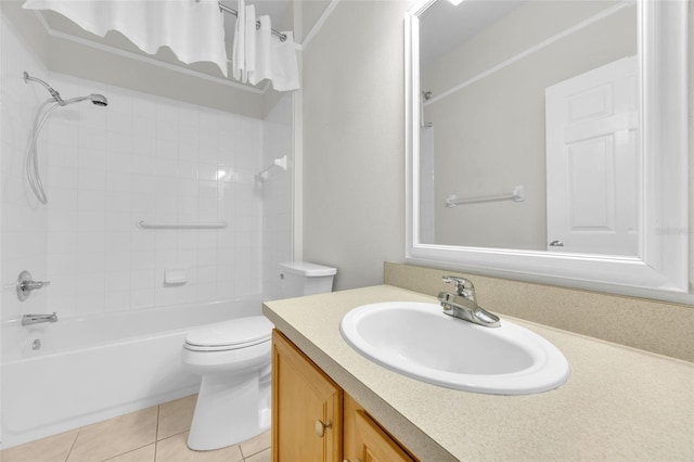 full bath with vanity, tile patterned floors, toilet, and shower / tub combination