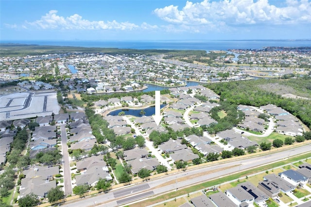 aerial view featuring a residential view and a water view
