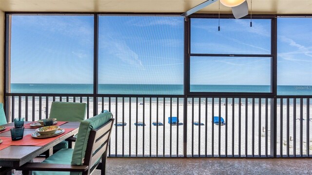 13720 Gulf Blvd Unit 305, Madeira Beach, FL 33708 - sunroom featuring a beach view and a water view