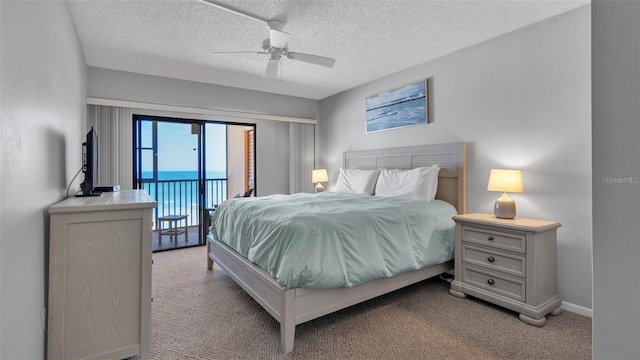 13720 Gulf Blvd Unit 305, Madeira Beach, FL 33708 - carpeted bedroom featuring a textured ceiling, ceiling fan, access to exterior, and baseboards