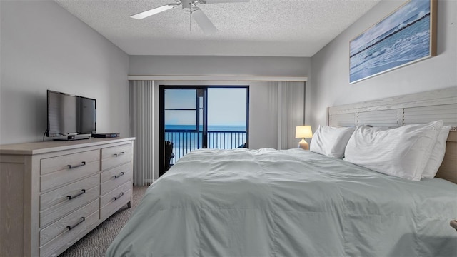 13720 Gulf Blvd Unit 305, Madeira Beach, FL 33708 - bedroom with a textured ceiling, ceiling fan, and access to outside