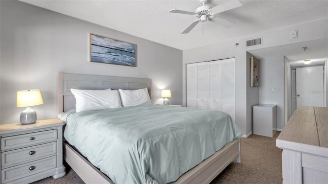 13720 Gulf Blvd Unit 305, Madeira Beach, FL 33708 - bedroom with visible vents, a textured ceiling, a closet, and carpet
