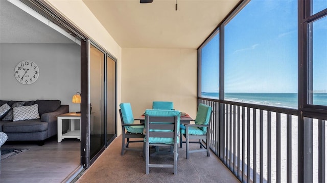 13720 Gulf Blvd Unit 305, Madeira Beach, FL 33708 - sunroom featuring a wealth of natural light and a water view