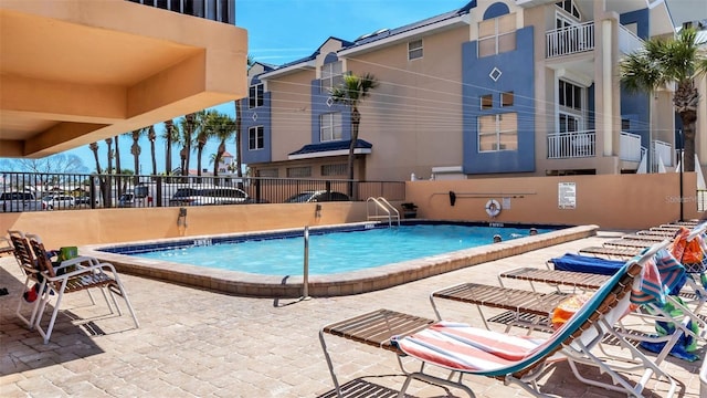 13720 Gulf Blvd Unit 305, Madeira Beach, FL 33708 - community pool featuring fence and a patio area