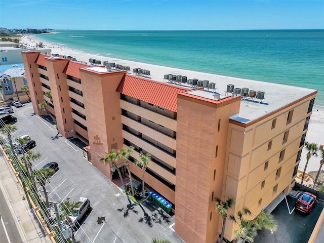 13720 Gulf Blvd Unit 305, Madeira Beach, FL 33708 - drone / aerial view with a water view and a view of the beach