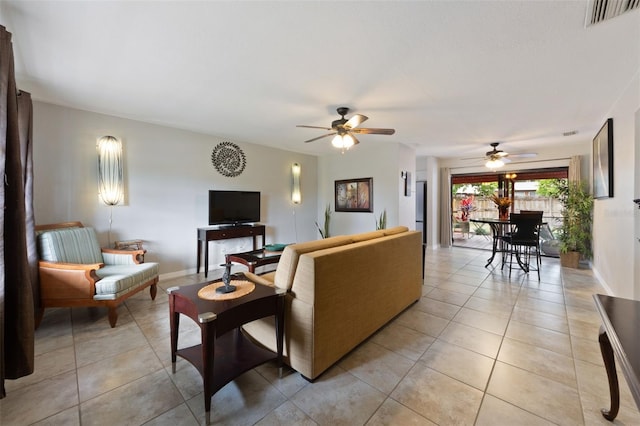5561 24th Ter N, Saint Petersburg, FL 33710 - living area with a ceiling fan, light tile patterned flooring, and baseboards