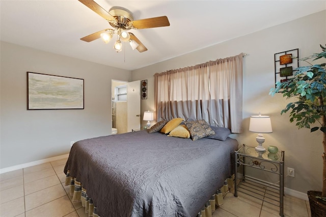 5561 24th Ter N, Saint Petersburg, FL 33710 - bedroom with baseboards, light tile patterned floors, and a ceiling fan