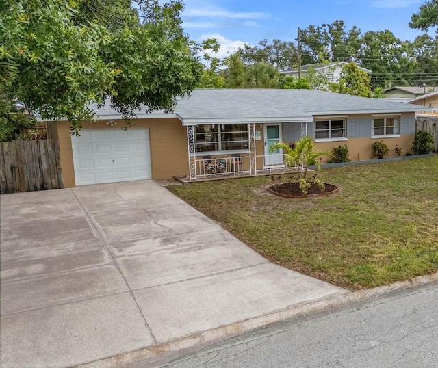 5561 24th Ter N, Saint Petersburg, FL 33710 - view of front of property featuring a garage, concrete driveway, and a porch