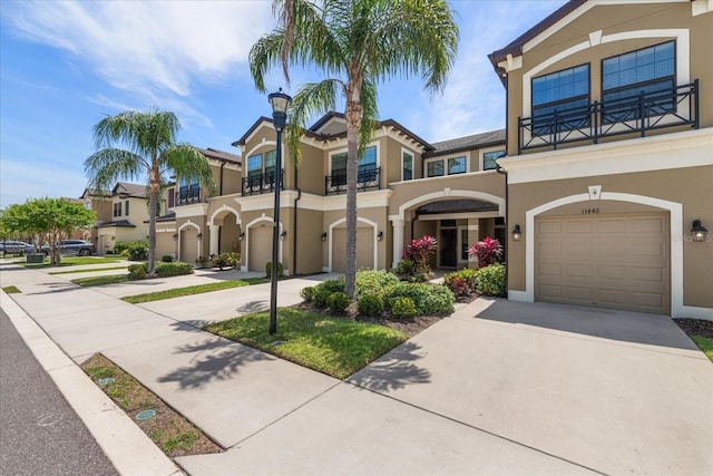 11442 Crowned Sparrow Ln, Tampa, FL 33626 - mediterranean / spanish home with stucco siding, driveway, and a balcony
