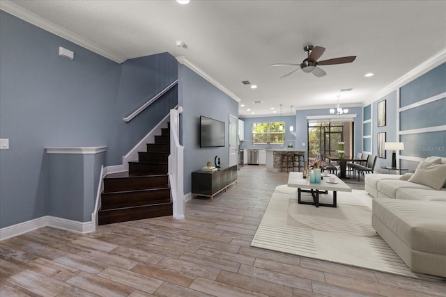 11442 Crowned Sparrow Ln, Tampa, FL 33626 - living room with stairway, recessed lighting, ornamental molding, wood finished floors, and ceiling fan with notable chandelier