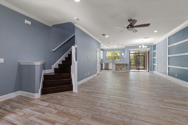 11442 Crowned Sparrow Ln, Tampa, FL 33626 - unfurnished living room featuring stairway, recessed lighting, ornamental molding, wood finished floors, and ceiling fan with notable chandelier