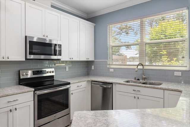 11442 Crowned Sparrow Ln, Tampa, FL 33626 - kitchen featuring a sink, backsplash, ornamental molding, white cabinets, and appliances with stainless steel finishes